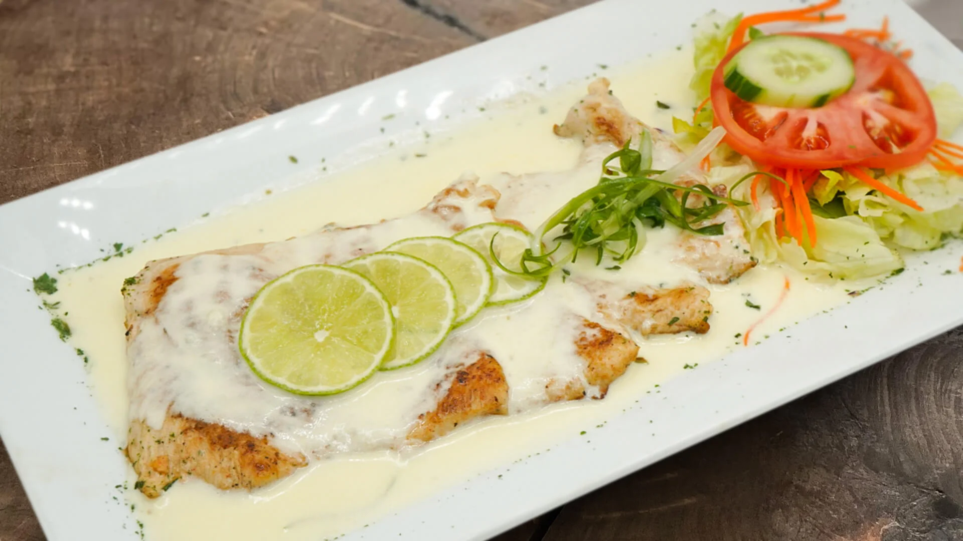 Chicken Breast in Lemon Cream on dark wooden table