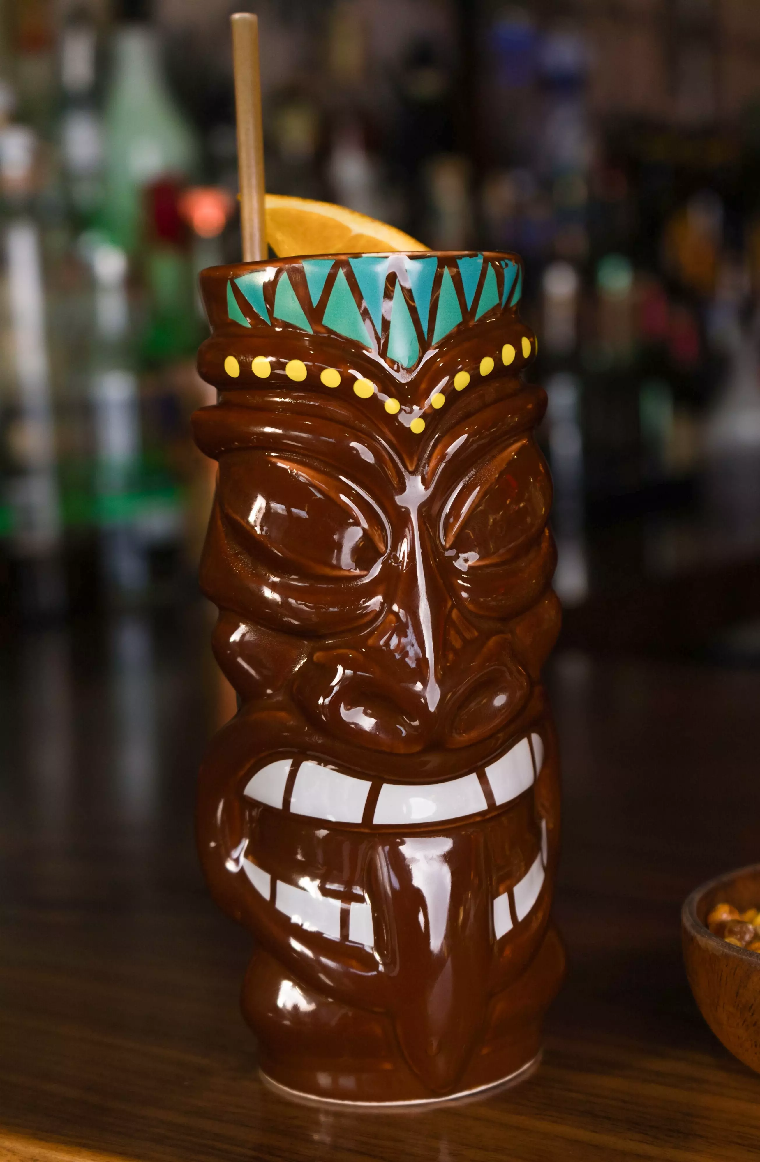 Drink in a tiki doll glass